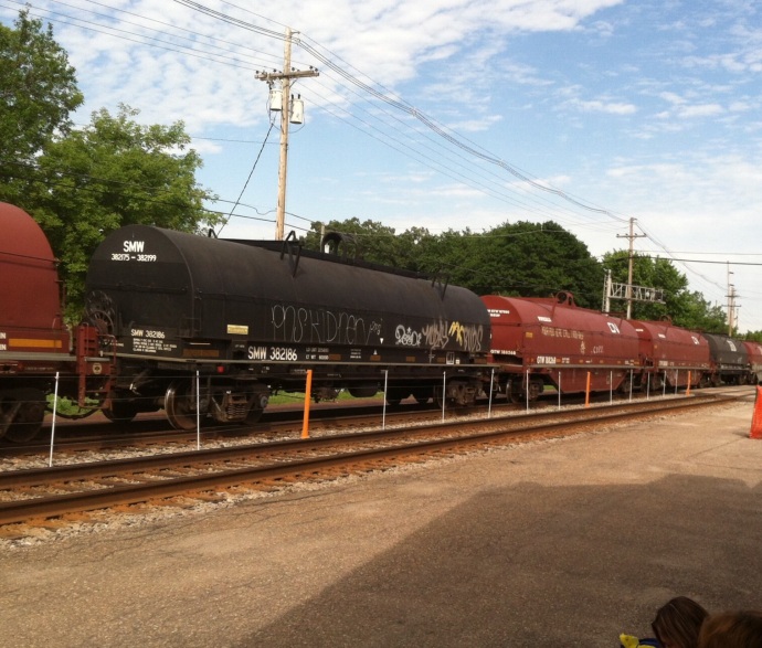 Standing in Columbus WI watching a freight train roar by