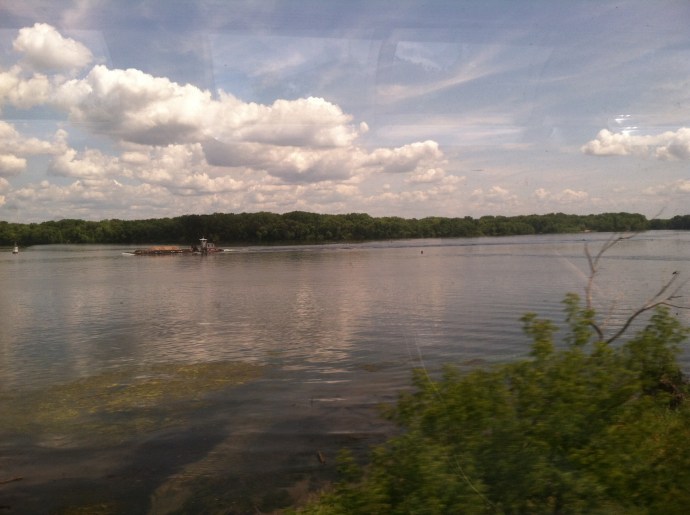 Tow boat with a single barge on Mississippi RIver