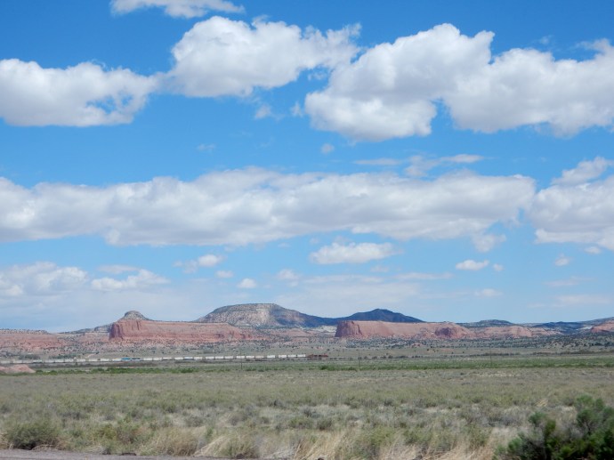 Driving to Flagstaff in Arizona with BNSF train near base of mountains