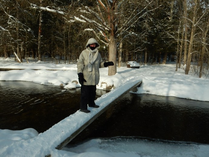 Chris walking over the headwaters of the Mississippi River